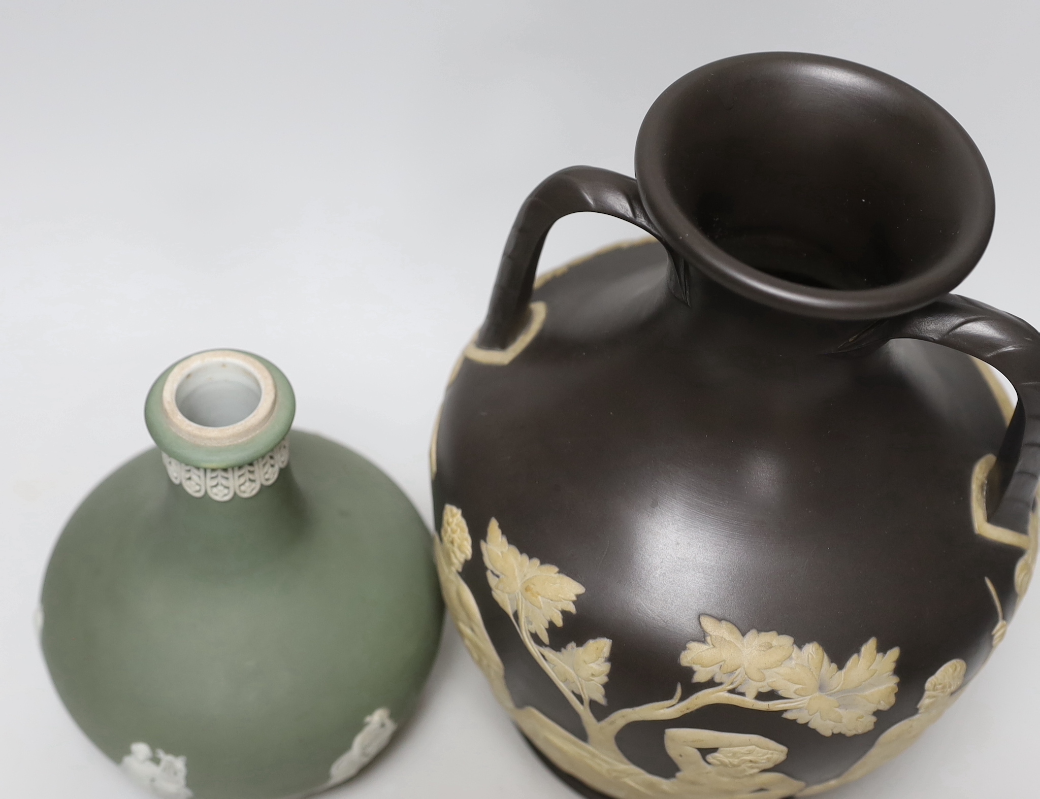 Attributed to Wedgwood, a jasper ware copy of the Portland vase, unmarked and a Wedgwood jasperware vase, tallest 25cm